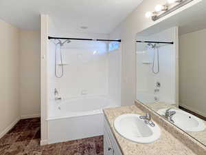 Primary bathroom with large soaker tub, shower, and large vanity with lots of counter space