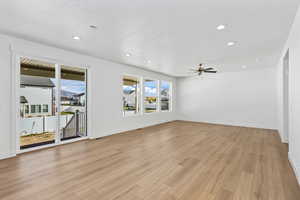 Spare room with recessed lighting, light wood-style flooring, and a ceiling fan