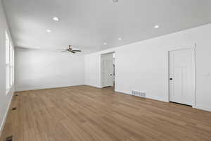 Spare room featuring recessed lighting, light wood-type flooring, and a ceiling fan
