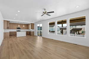 Unfurnished living room featuring recessed lighting, light wood finished floors, and a ceiling fan