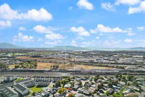 Aerial perspective of suburban area with a mountain backdrop
