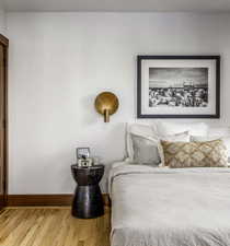 Bedroom with light wood-style flooring and baseboards