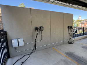 Exterior view of stucco siding and electric vehicle charger
