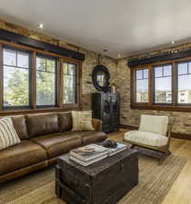 Living area with wood finished floors and recessed lighting