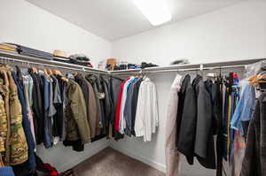 Large walk-in primary closet.