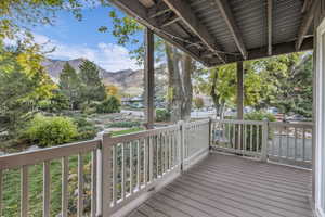 Wooden deck featuring a mountain view