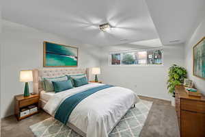 Bedroom with carpet floors and baseboards