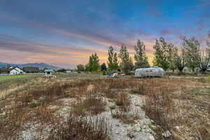 View of yard featuring a mountain view and a view of countryside