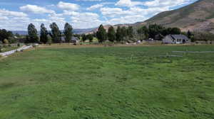 View of mountain background with rural landscape and agricultural land