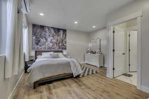Bedroom with recessed lighting and light wood finished floors