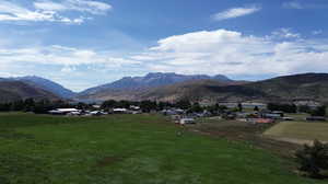 View of mountain backdrop with rural landscape
