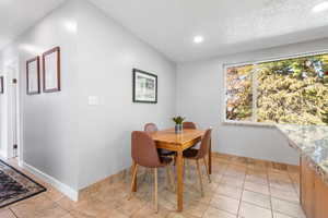 Dining space with recessed lighting and a textured ceiling