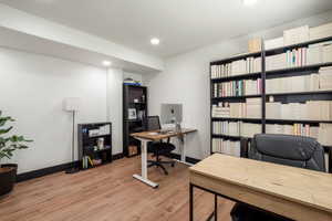Office space or 4th bedroom, featuring light wood-type flooring and recessed lighting