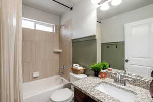 Full bathroom featuring vanity and shower / tub combo