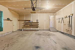 Garage featuring a garage door opener