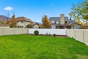 View of fenced backyard