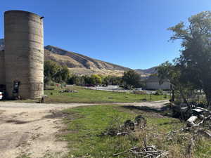 View of mountain backdrop featuring rural landscape