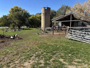 View of yard with an exterior structure and an outdoor structure