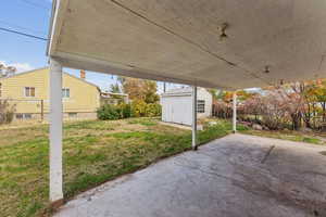 View of patio / terrace featuring a shed