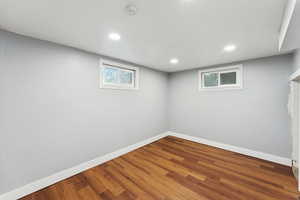 Below grade area featuring recessed lighting and wood finished floors