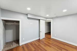 Unfurnished bedroom featuring wood finished floors and recessed lighting