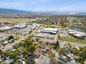 Aerial view of property's location with a mountain backdrop