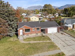 Aerial perspective of suburban area featuring a mountain backdrop