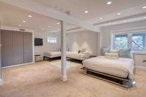 Bedroom featuring light carpet and recessed lighting