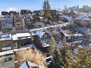 Snowy aerial view with a residential view