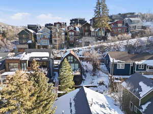 Snowy aerial view with a residential view