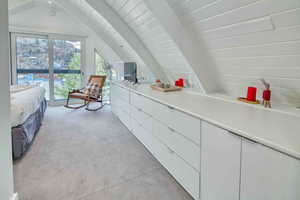 Bedroom featuring light carpet, access to outside, and wood ceiling