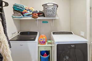 Laundry room featuring separate washer and dryer