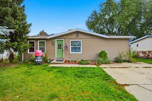View of front of property with a front lawn