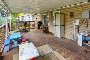View of patio featuring a deck and grilling area