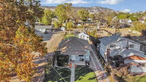 Aerial perspective of suburban area with a mountain backdrop