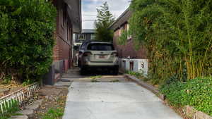 View of side of home featuring brick siding