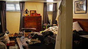 Bedroom featuring a textured wall