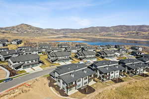 Aerial perspective of suburban area with a water and mountain view
