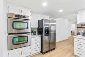 Kitchen with stainless steel double in-wall oven