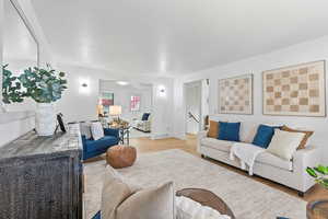 Living room with new LVP Flooring and lighting