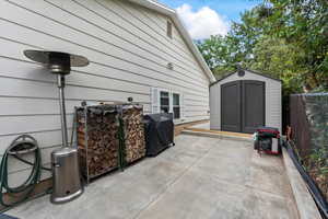 View of patio with a storage shed and extra parking/RV