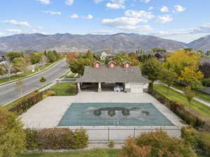 View of swimming pool featuring a patio area and a mountain view