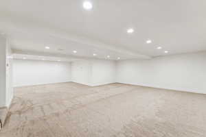 Finished basement featuring recessed lighting and light colored carpet