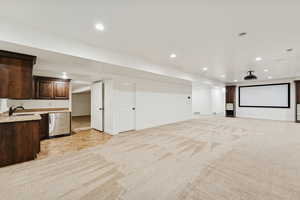 Cinema room featuring light carpet and recessed lighting