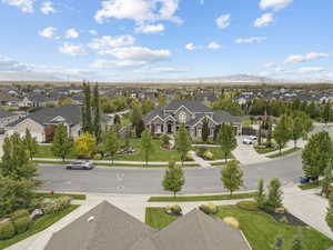 Aerial perspective of suburban area with a mountain backdrop