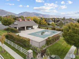 View of swimming pool featuring a patio and a mountain view