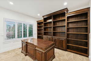 Office area featuring light carpet and recessed lighting