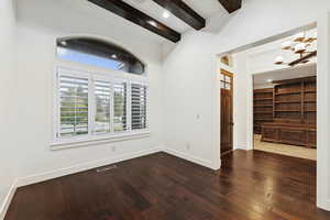 Unfurnished room with beamed ceiling, dark wood-style floors, and recessed lighting