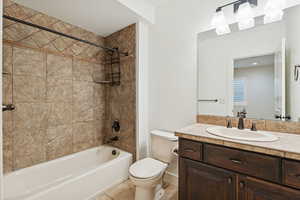 Full bathroom featuring vanity, shower / tub combination, and light tile patterned floors