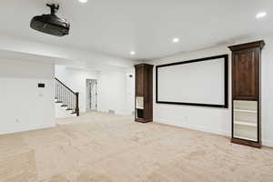 Cinema with recessed lighting and light carpet